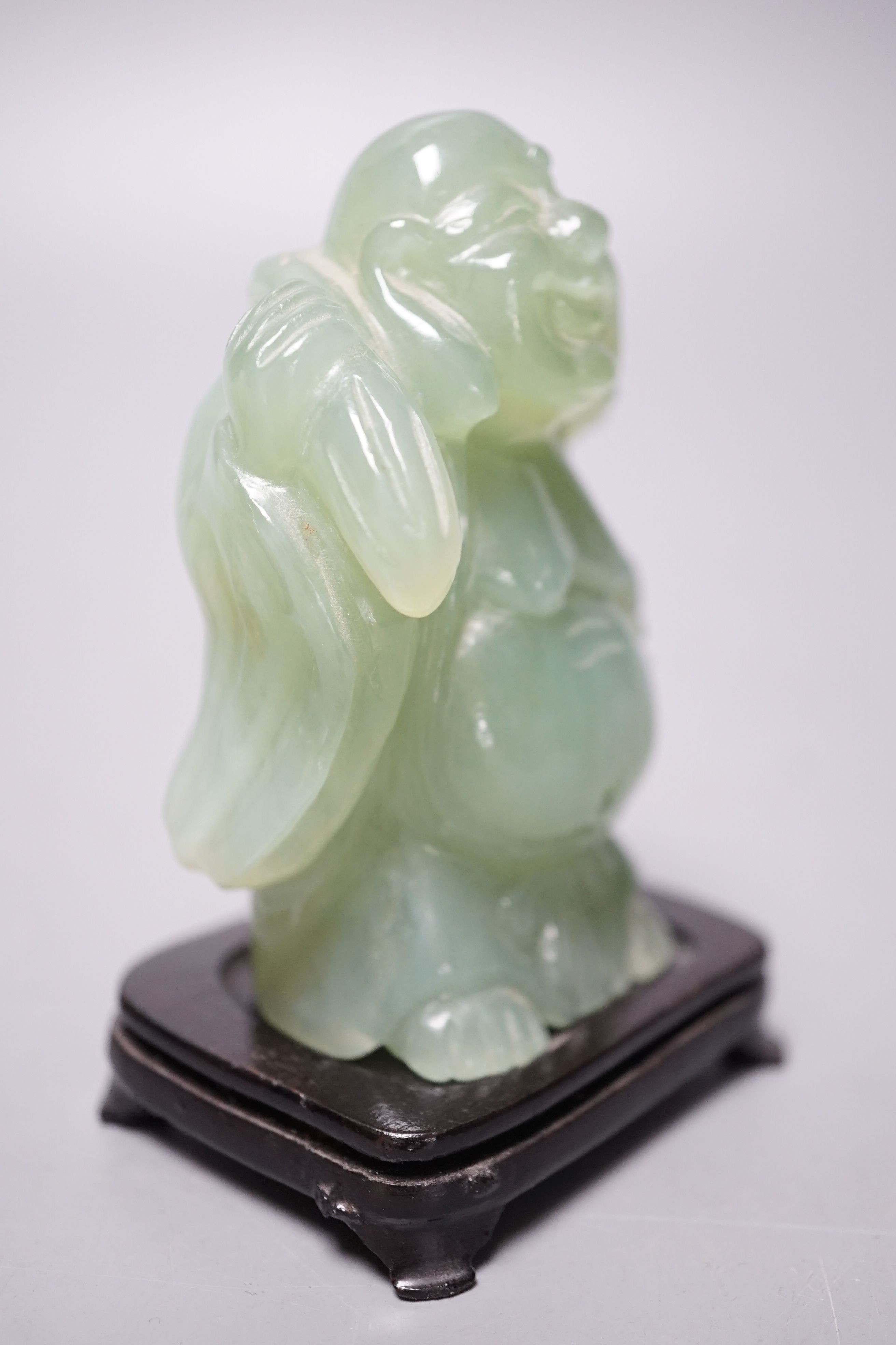 Two bowenite carvings of an elephant and Budai, wood stands, tallest, 9.5cm